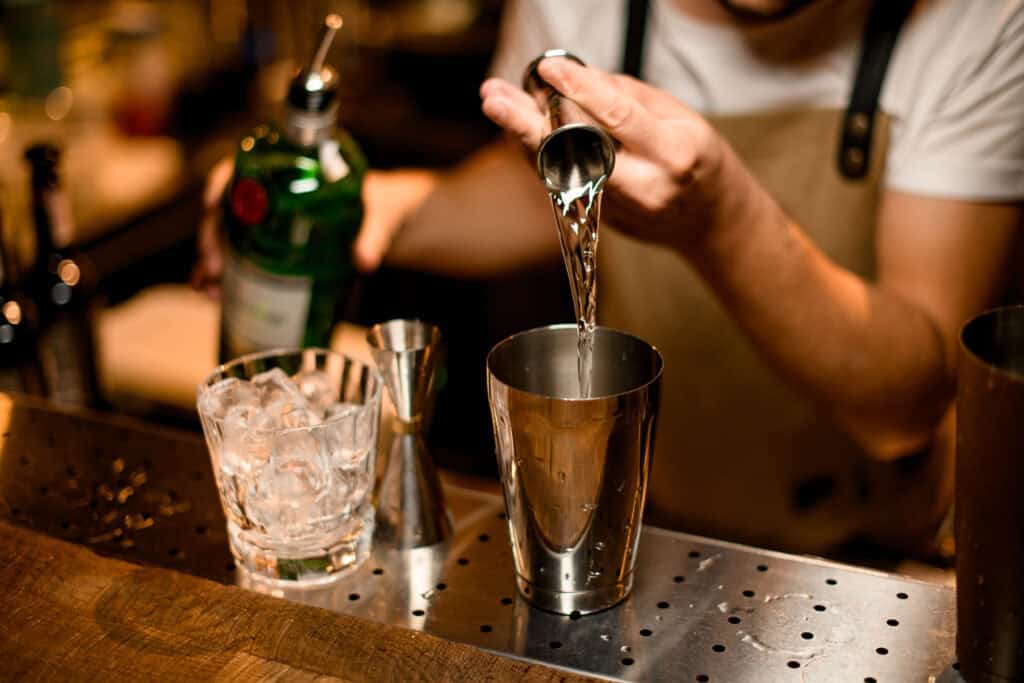Bartender pouring a cocktail