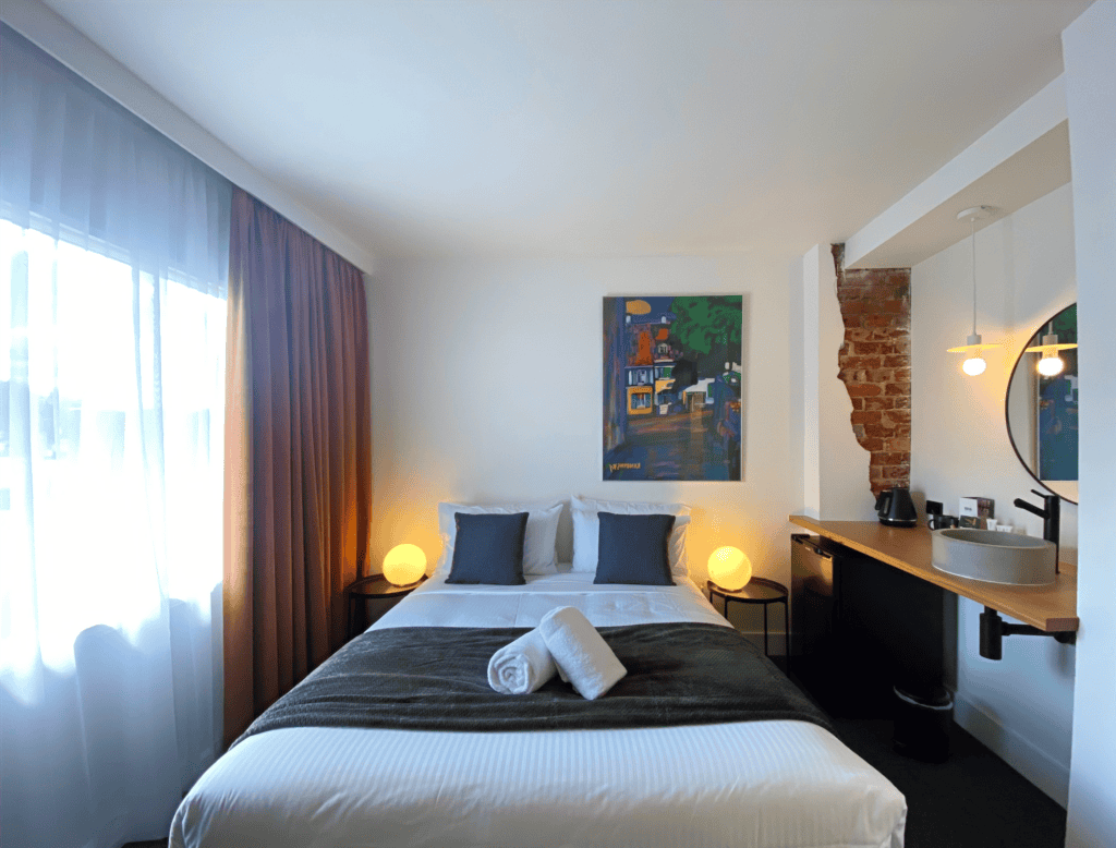 Motel room with double bed and desk