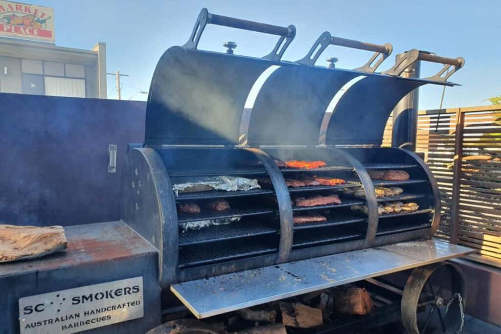 Offset smoker barbecue with meat